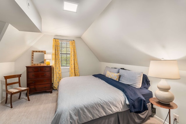 bedroom with light carpet and lofted ceiling