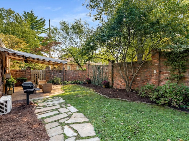 view of yard with a patio area, ceiling fan, and an outdoor living space