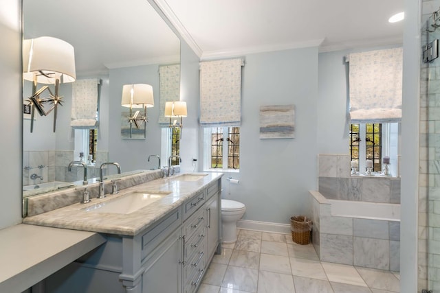 bathroom featuring vanity, toilet, ornamental molding, and tiled tub