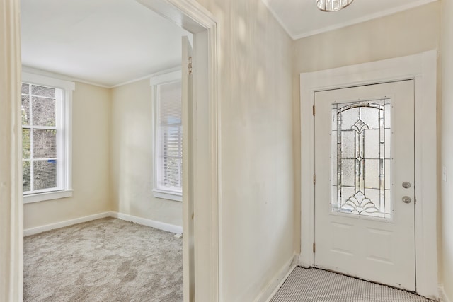 entrance foyer featuring light carpet and crown molding