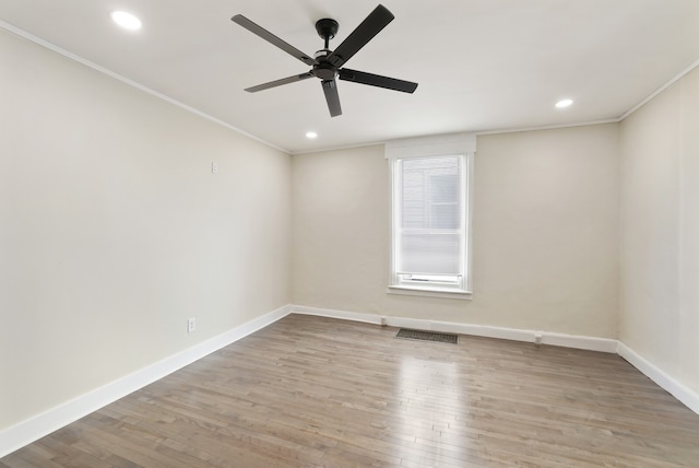 unfurnished room with ceiling fan, ornamental molding, and light hardwood / wood-style flooring