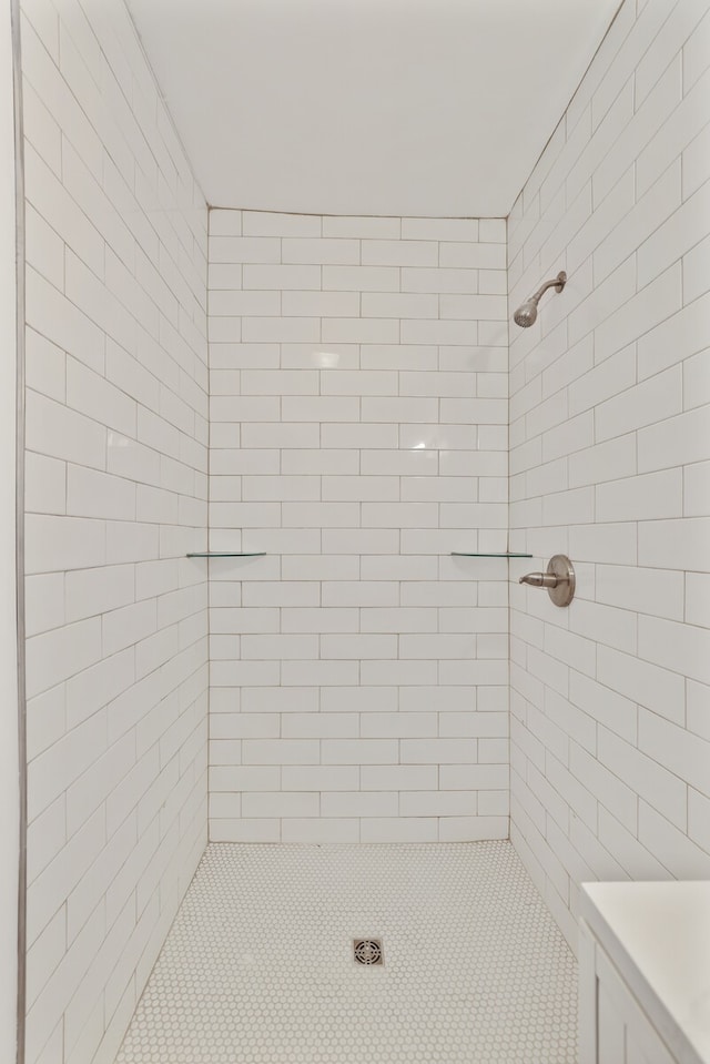 bathroom with tiled shower