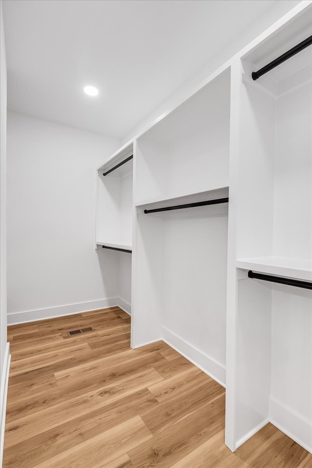 walk in closet featuring light hardwood / wood-style floors