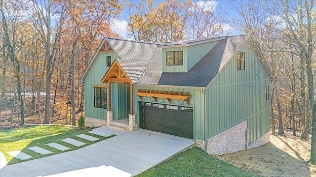 view of front of house with a front yard and a garage