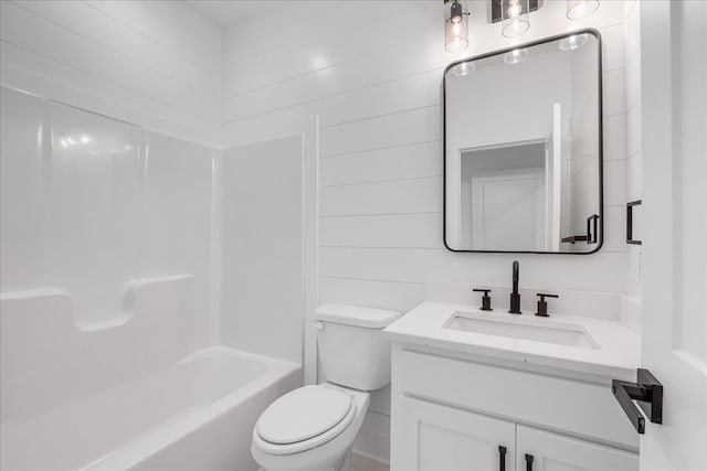 full bathroom featuring vanity, toilet, shower / bathtub combination, and wooden walls