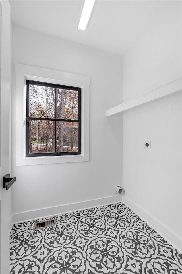 clothes washing area featuring electric dryer hookup