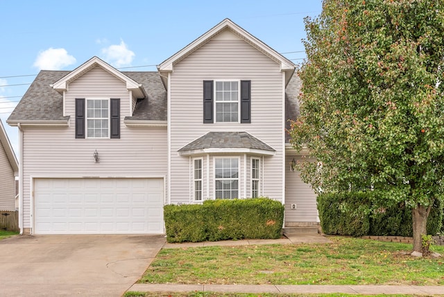 front of property featuring a garage and a front lawn