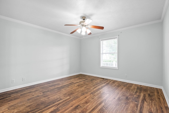 spare room featuring dark hardwood / wood-style floors, ceiling fan, and ornamental molding