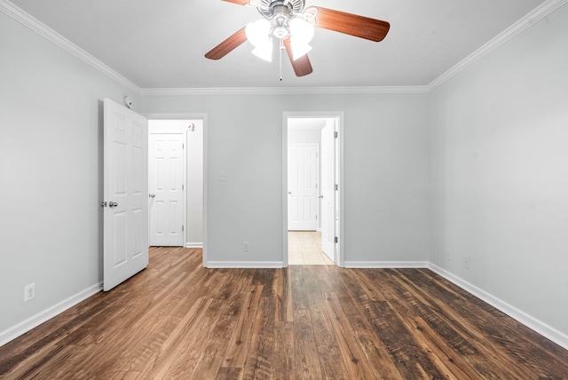 unfurnished bedroom featuring ceiling fan, crown molding, and dark hardwood / wood-style floors