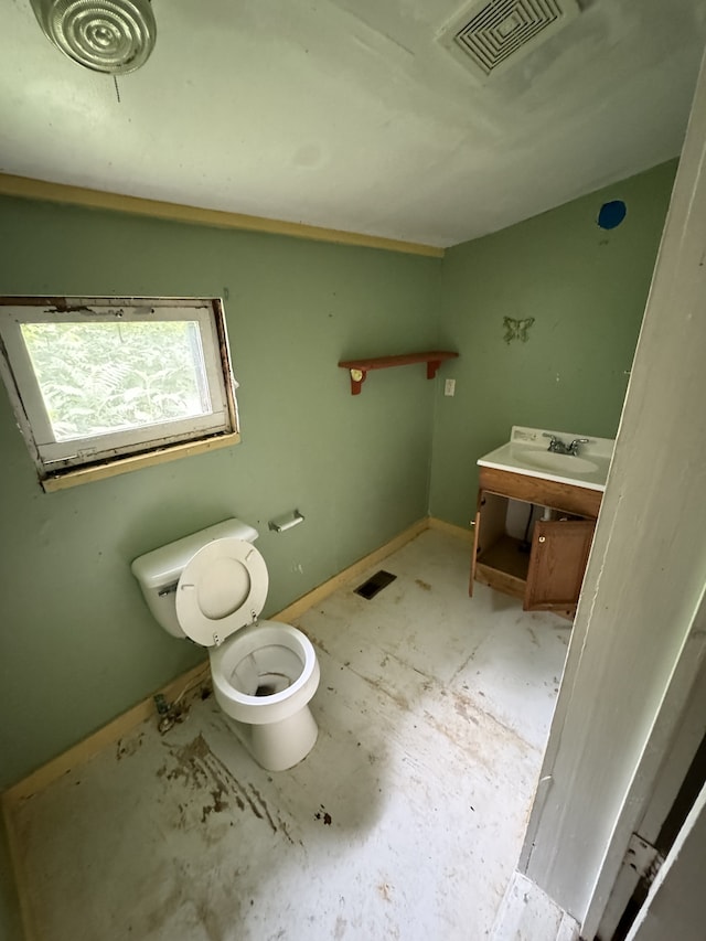 bathroom with vanity and toilet