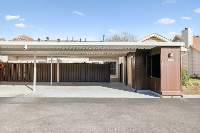 view of front of home featuring a carport