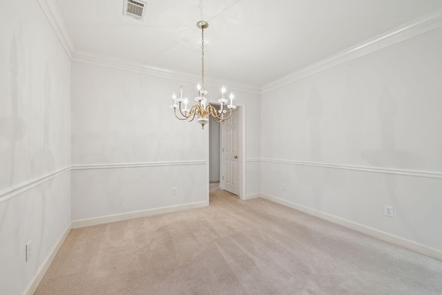 spare room featuring a chandelier, light carpet, and crown molding