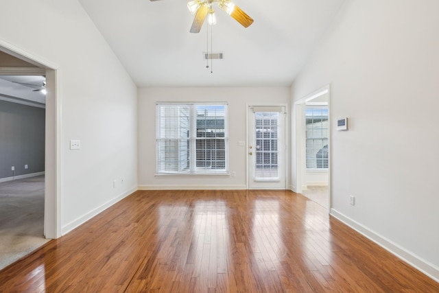 spare room with ceiling fan, wood-type flooring, and lofted ceiling