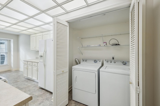 washroom with washing machine and dryer