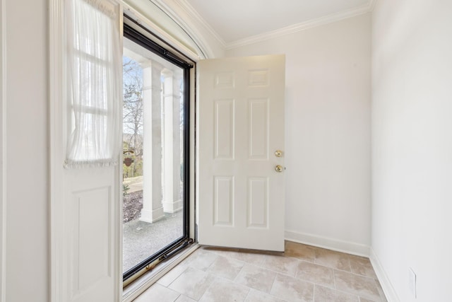 foyer featuring ornamental molding and light tile patterned floors