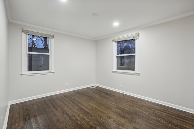 unfurnished room featuring dark hardwood / wood-style floors and crown molding