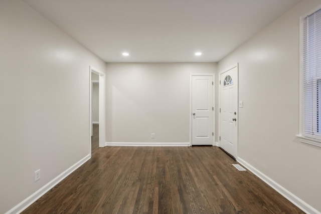 foyer entrance featuring dark hardwood / wood-style floors