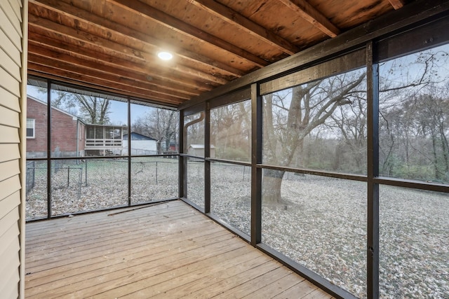 unfurnished sunroom with wooden ceiling