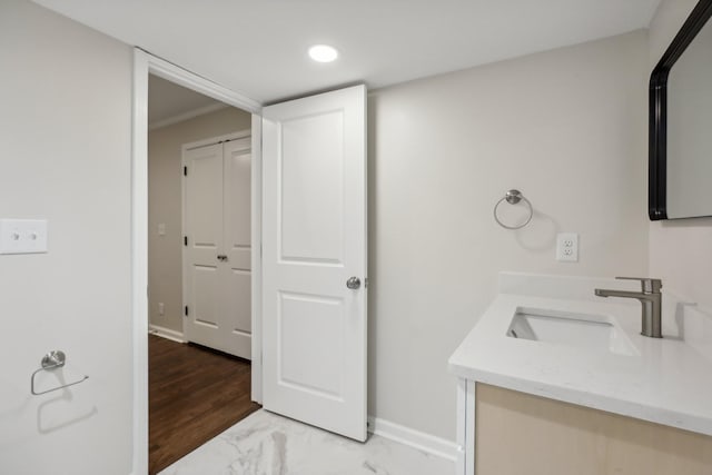 bathroom featuring vanity and hardwood / wood-style flooring