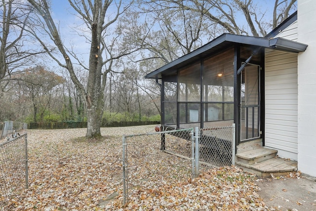 view of yard featuring a sunroom