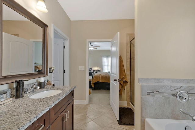 bathroom with ceiling fan, vanity, and plus walk in shower