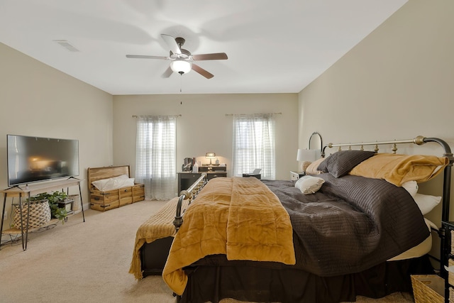 bedroom with light carpet and ceiling fan