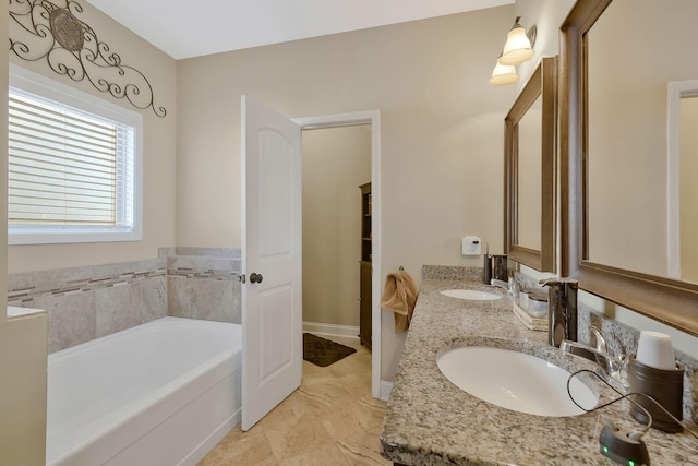 bathroom with a bathing tub and vanity