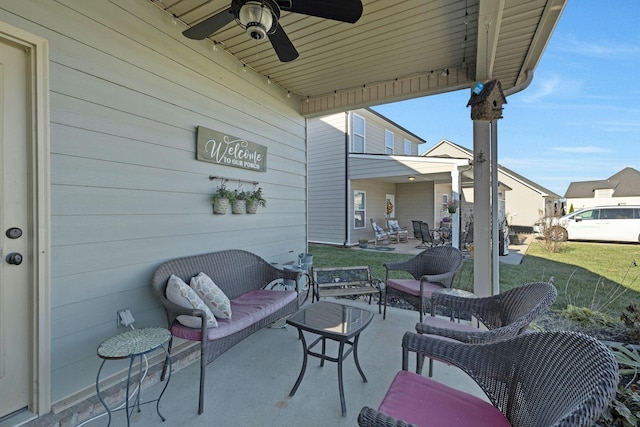 view of patio with outdoor lounge area and ceiling fan