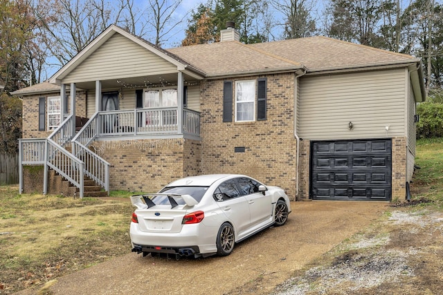 ranch-style house with a porch and a garage