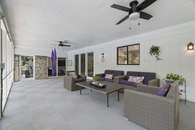 living room featuring ceiling fan and wooden ceiling