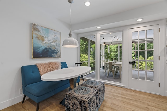 sitting room with plenty of natural light and hardwood / wood-style flooring