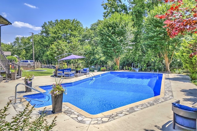 view of pool featuring a patio