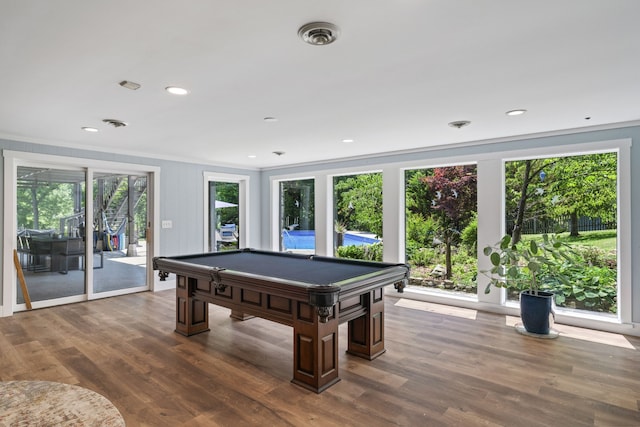 recreation room featuring ornamental molding, dark hardwood / wood-style floors, and pool table