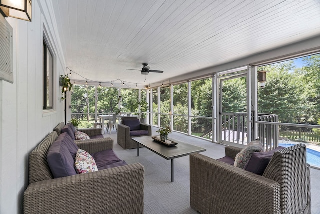 sunroom with track lighting, ceiling fan, and wooden ceiling