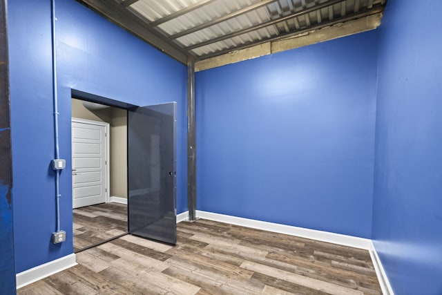 unfurnished room featuring wood-type flooring