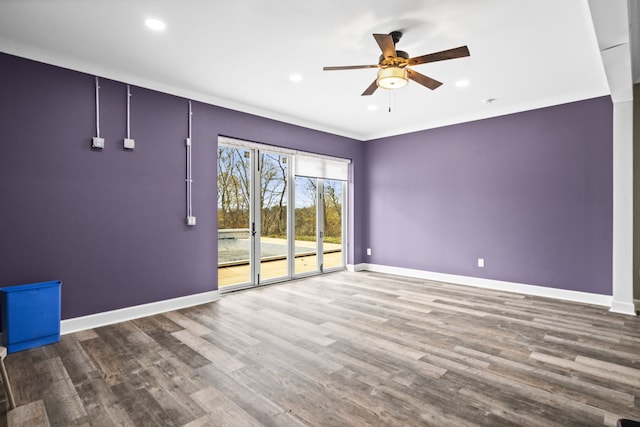 unfurnished room with ceiling fan and hardwood / wood-style flooring