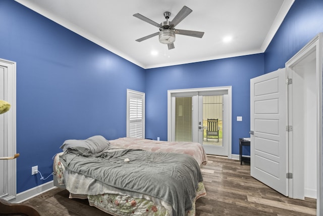 bedroom with dark wood-type flooring, ceiling fan, and crown molding