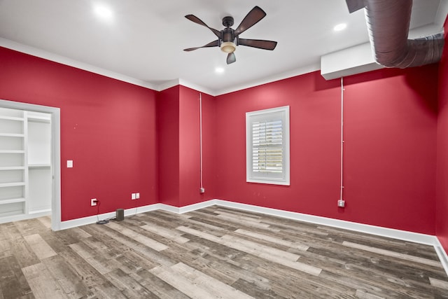 empty room with ceiling fan and wood-type flooring