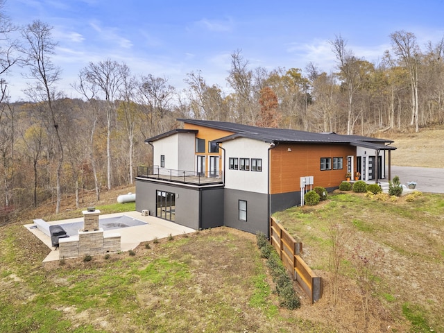 exterior space with a patio area and a yard