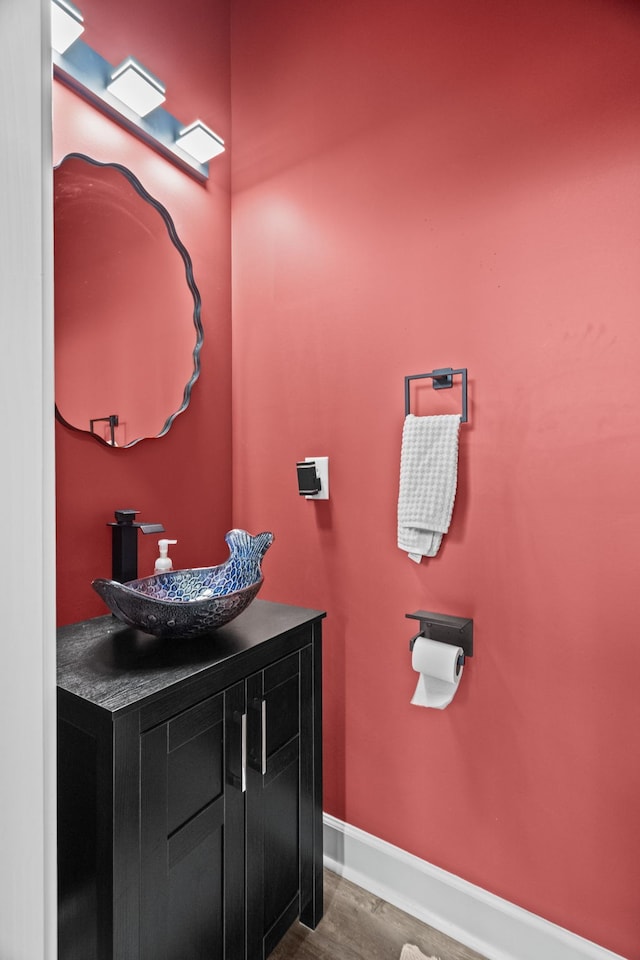 bathroom featuring wood-type flooring and vanity