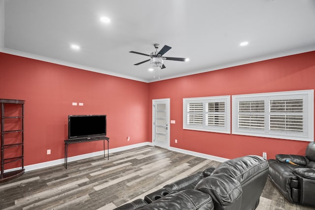 living room with ceiling fan, ornamental molding, and hardwood / wood-style flooring