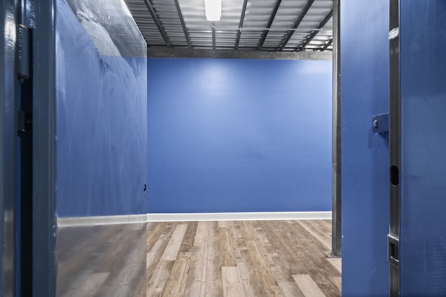 empty room with hardwood / wood-style flooring