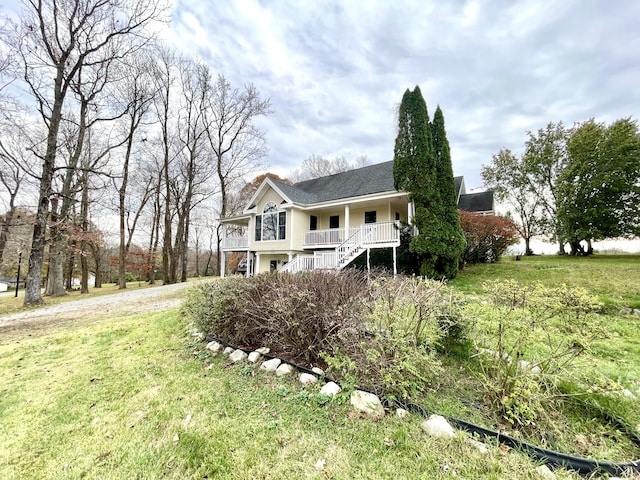 view of front of home with a front lawn and a porch