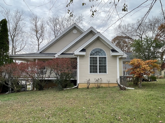 view of property exterior featuring a lawn