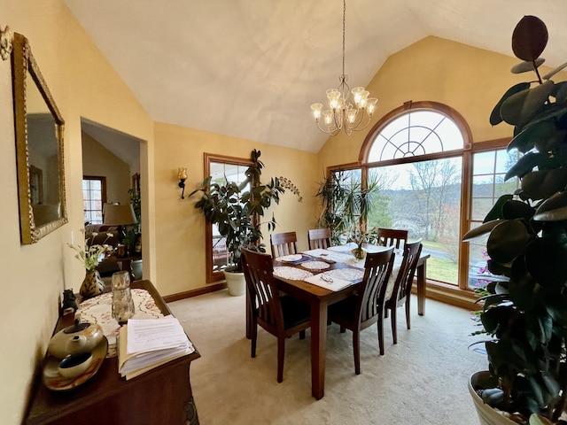 dining space with light colored carpet, vaulted ceiling, and a healthy amount of sunlight