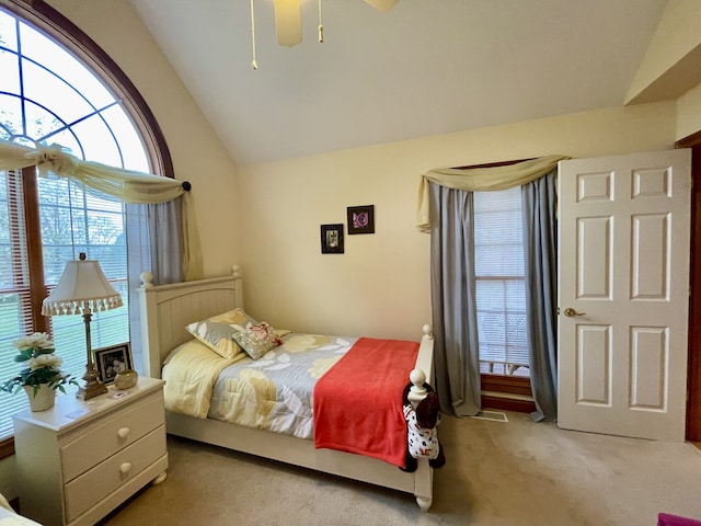 carpeted bedroom featuring ceiling fan and lofted ceiling