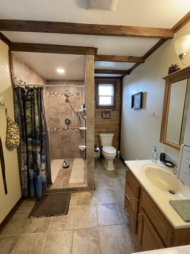 bathroom with a shower with curtain, tile patterned flooring, vanity, and toilet