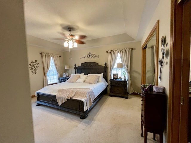 bedroom with light carpet, a closet, and ceiling fan