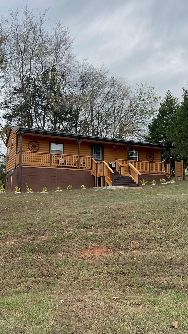 314 Birdsong Dr, Cadiz, KY 42211 - view of front of home with a deck and a front lawn