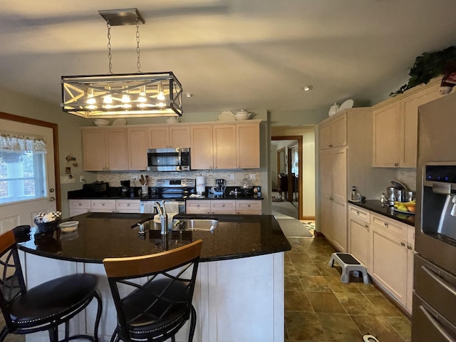 314 Birdsong Dr, Cadiz, KY 42211 - kitchen with appliances with stainless steel finishes, dark countertops, and decorative backsplash